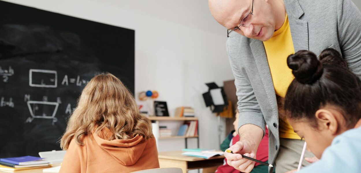 teacher helping a student